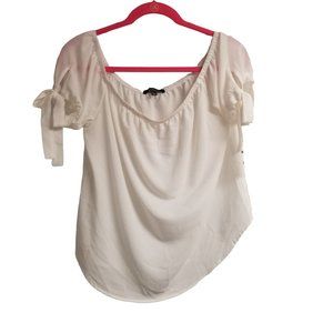 Ambiance white blouse with ties on sleeves.